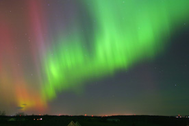 pink and green northern lights over Wisconsin