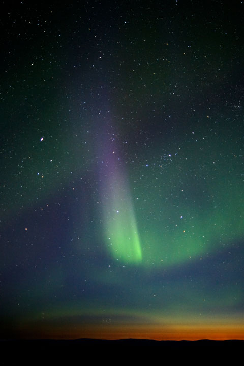 multicolored northern lights display at twilight